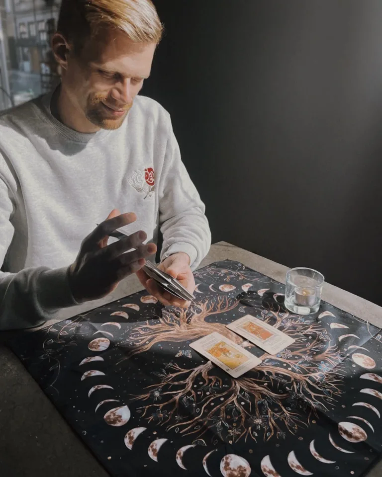 Mark doing a tarot reading in a cafe